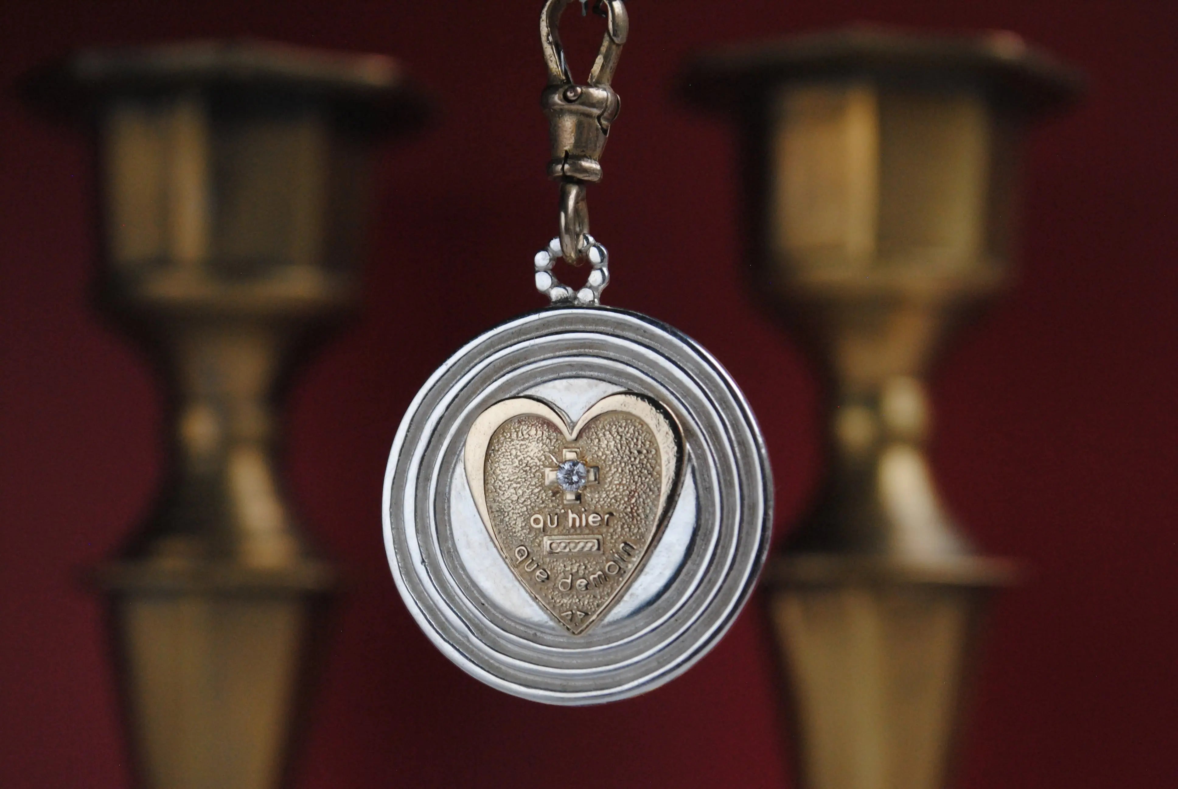 Gold & Silver diamond Heart Pendant On red background