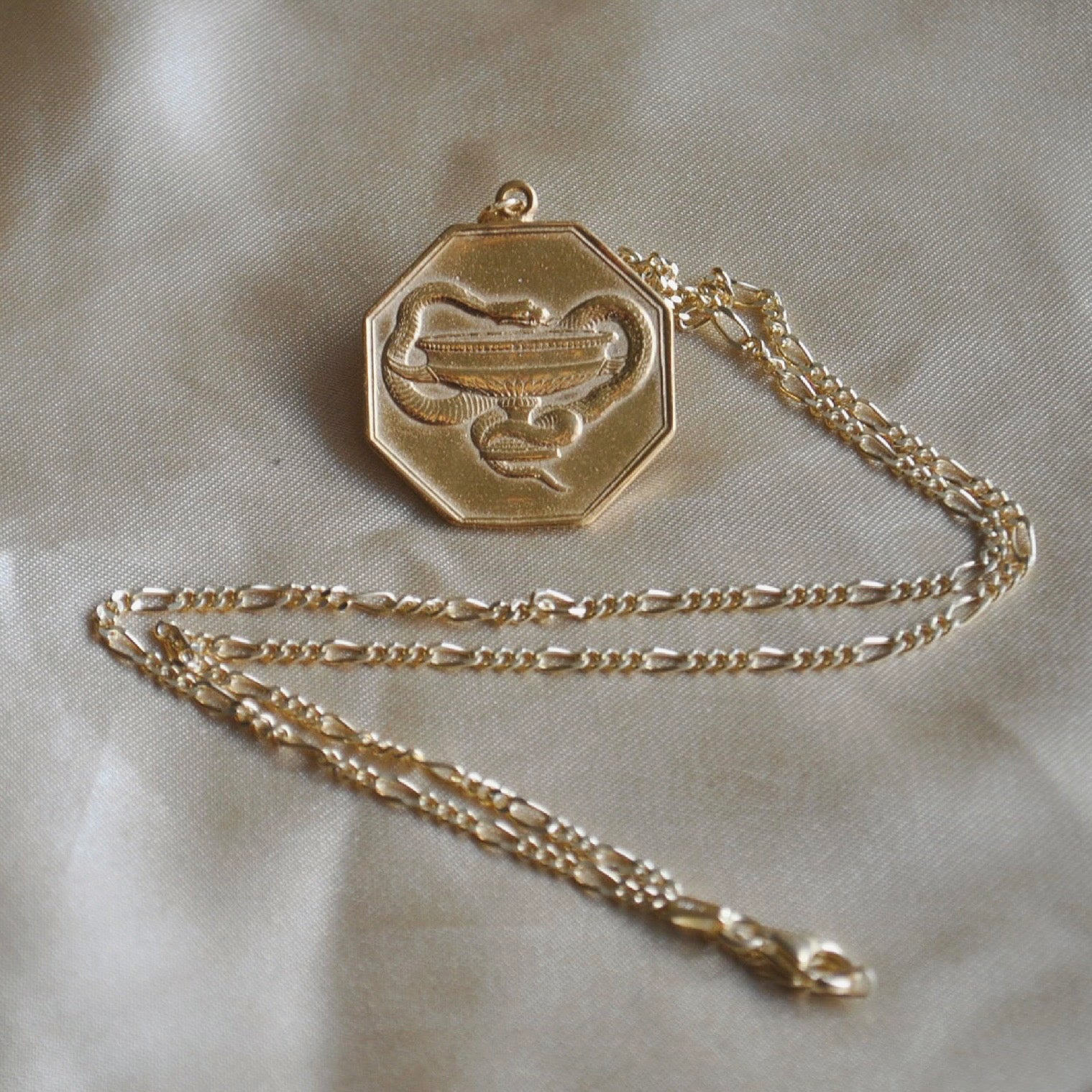 The Baptist-Ophis necklace